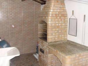 a brick oven in a bathroom with a sink at Arraial do Cabo in Arraial do Cabo +18 photos