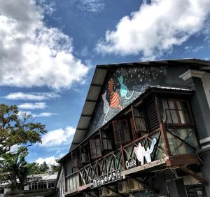 a building with a painting on the side of it at QuiikCat in Kuching