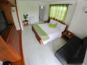 Postel nebo postele na pokoji v ubytování Casa Royal Palm Inn