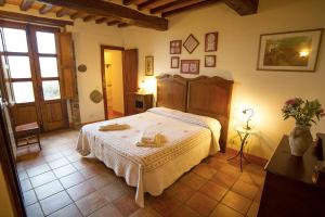 a bedroom with a large bed in a room at Podere Pietreta in Radicofani