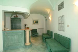 Istumisnurk majutusasutuses Albergo Olmitello - cucina vegetariana bio e tradizionale