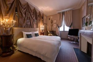 Postel nebo postele na pokoji v ubytování Hôtel Particulier le 28