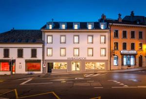 a building on the corner of a street at Ambassador Boutique Hotel in Nyon