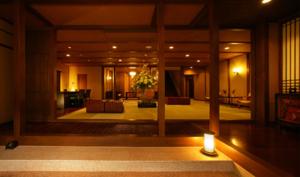 a lobby of a hotel with a candle on the floor at Hakone Onsen Ryokan Yaeikan in Hakone
