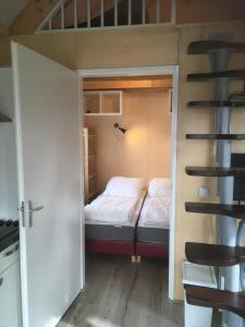Кровать или кровати в номере Huisje 19 Zoutelande