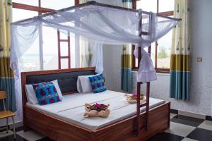 Кровать или кровати в номере Mocco Beach Villa