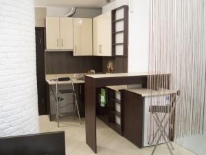 Кухня или кухненски бокс в Studio-Flat Apartments