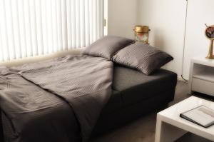 Postel nebo postele na pokoji v ubytování Zicht op Zee