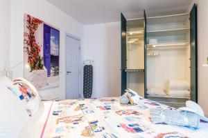 a bedroom with a bed and a large mirror at LOFT in Varna City
