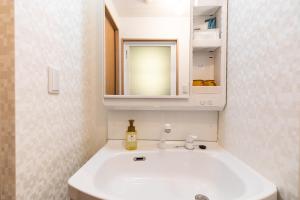 Ett badrum på Condominium Hotel Likka in Nago