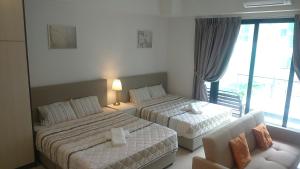Ένα ή περισσότερα κρεβάτια σε δωμάτιο στο Holiday Home @ Midhills Genting +40 φωτογραφίες
