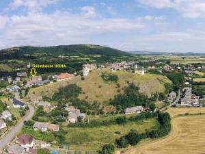 an aerial view of a small town on a hill at Guesthouse Ilona in Veľký Kamenec