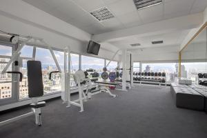 a gym with a view of the city at Taipei Garden Hotel - Ximending in Taipei