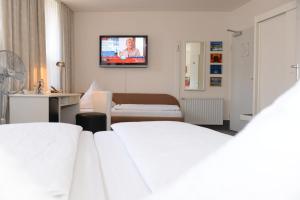Postel nebo postele na pokoji v ubytování Hotel Granus
