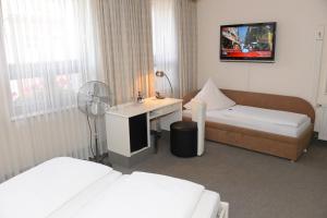 Postel nebo postele na pokoji v ubytování Hotel Granus