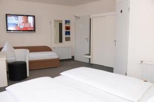 Postel nebo postele na pokoji v ubytování Hotel Granus