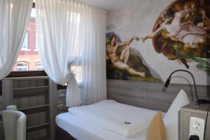 Postel nebo postele na pokoji v ubytování Hotel Granus