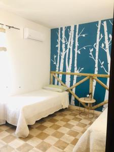 Postel nebo postele na pokoji v ubytování Agriturismo Podere Pescara