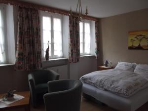 Postel nebo postele na pokoji v ubytování Hotel Haus Irsfeld + 6 fotografií