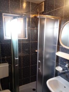 a bathroom with a shower and a sink at Ostoja in Polańczyk +28 photos