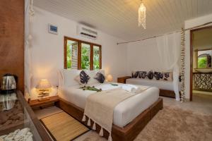 Postelja oz. postelje v sobi nastanitve Bliss Hotel Praslin