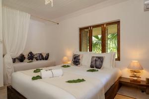 Postelja oz. postelje v sobi nastanitve Bliss Hotel Praslin