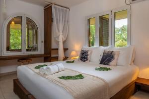 Postelja oz. postelje v sobi nastanitve Bliss Hotel Praslin