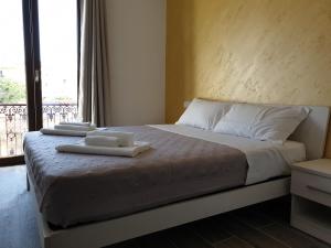 Giường trong phòng chung tại Giò Rooms