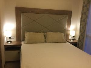 מיטה או מיטות בחדר ב-The Bard's Retreat