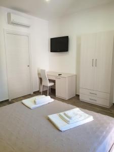 Giường trong phòng chung tại Giò Rooms