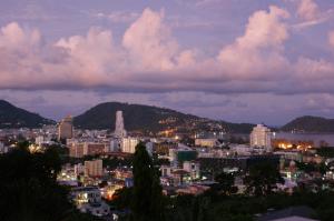 a view of a city at night at Prince Edouard Apartments & Resort SHA extra plus in Patong Beach