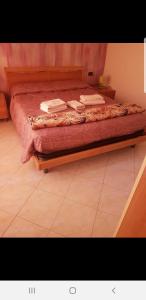 Postel nebo postele na pokoji v ubytování Caravaggio Apartments