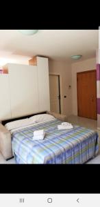Postel nebo postele na pokoji v ubytování Caravaggio Apartments