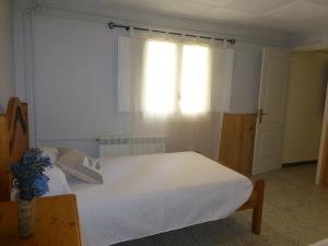 A bed or beds in a room at Casa Paco