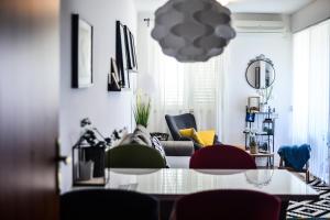 a living room with a table and chairs at A&M Cavtat, sunset 3 bedrooms apartment with parking in Cavtat