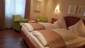 Postel nebo postele na pokoji v ubytování Hotel Anna