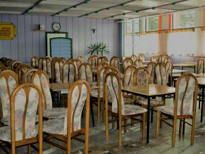 a row of tables and chairs in a room at D.W. Grażyna in Niechorze