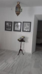 a room with a table with a book on it at Casa De Comedias in Almagro