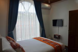 Ein Bett oder Betten in einem Zimmer der Unterkunft Villa Asimba