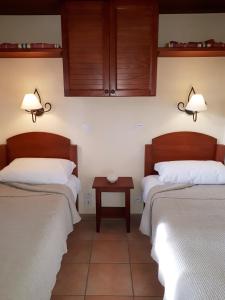 two beds sitting next to each other in a room at Parc Arradoy in Saint-Jean-Pied-de-Port