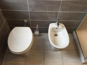 a bathroom with a toilet and a bidet at Affittacamere Belfiore in Florence