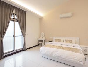 Cama ou camas em um quarto em Yilan NAI-JI House