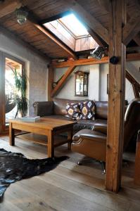 a living room with a couch and a table at Normandia in Kuźnica