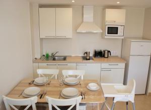 Kuchyň nebo kuchyňský kout v ubytování Bagari Apartments Camp de Mar