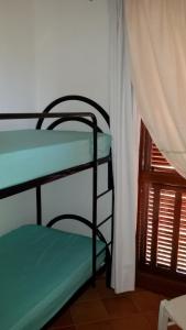 A bed or beds in a room at Mare & Mirice - Case Appartamenti Vacanza