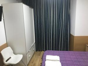 Cama o camas de una habitación en Hostal San Blas
