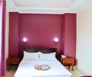 Postel nebo postele na pokoji v ubytování Diamonds Hotel Kampala