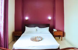 Postel nebo postele na pokoji v ubytování Diamonds Hotel Kampala