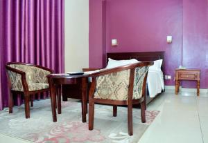 Postel nebo postele na pokoji v ubytování Diamonds Hotel Kampala