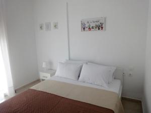 Posteľ alebo postele v izbe v ubytovaní Polychrono Nikos Apartment